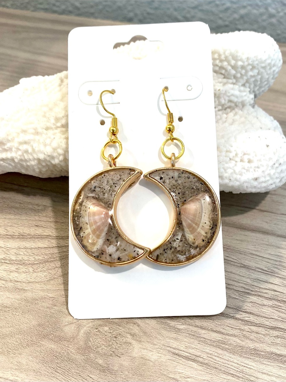 79. Gold Crescent Moon Sanibel Cocina Shell Drop Earrings with beach sand